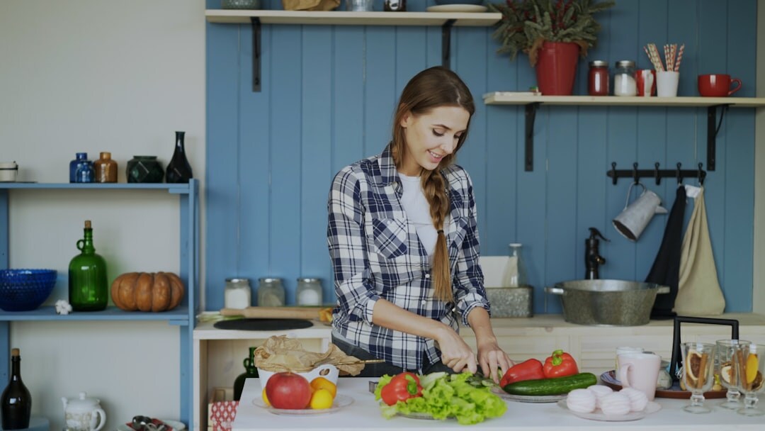 woman chopping fresh vegetables